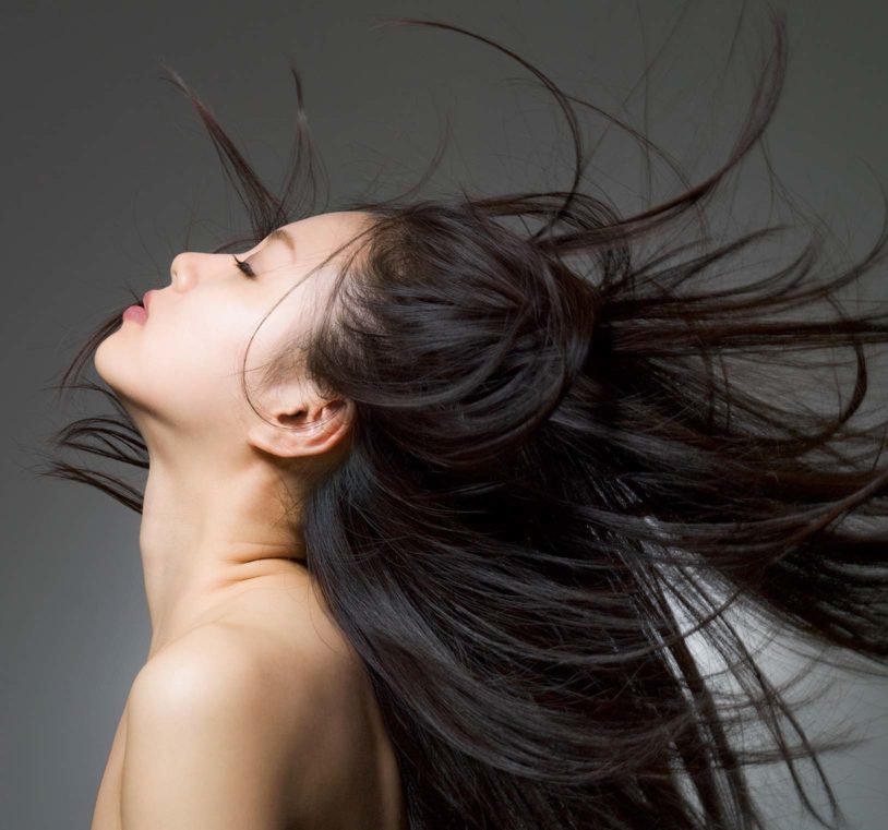 Woman flipping her hair back