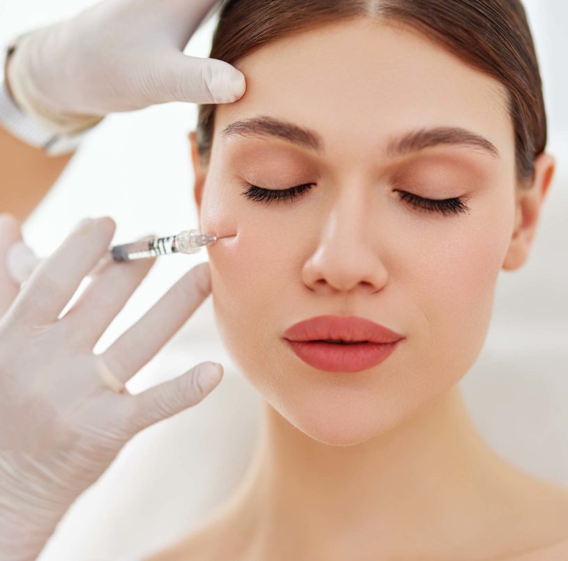 Woman getting dermal filler injections