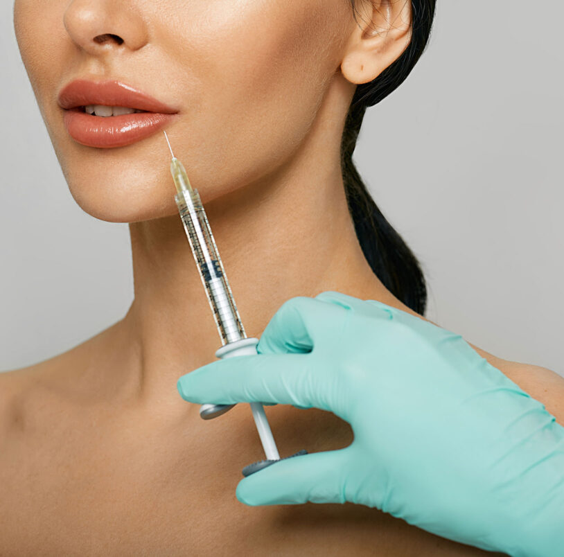 Woman getting dermal filler injections