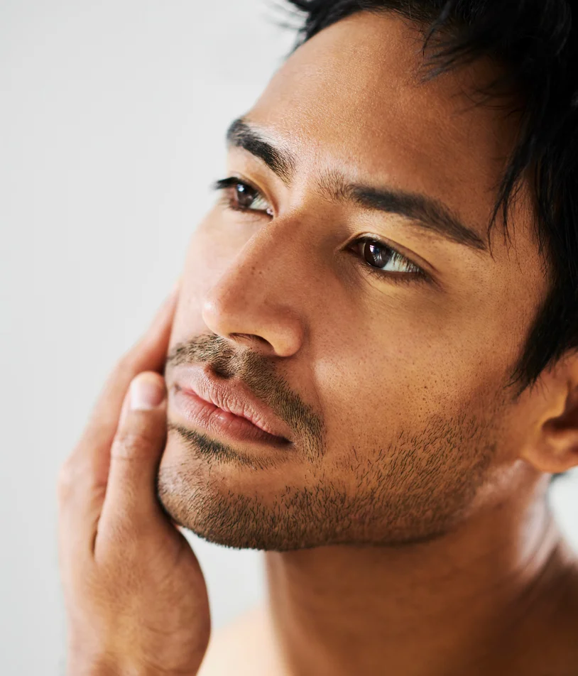 Man looking out of office window