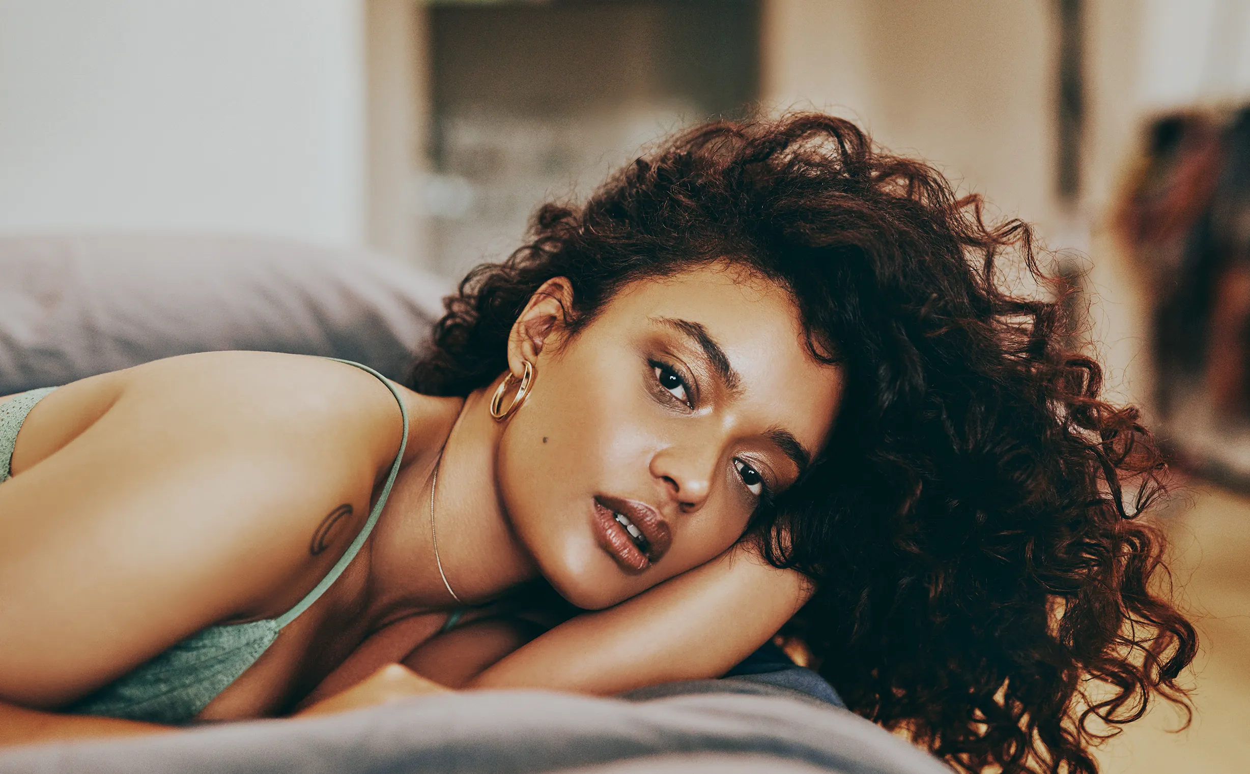 Woman in black bra sitting